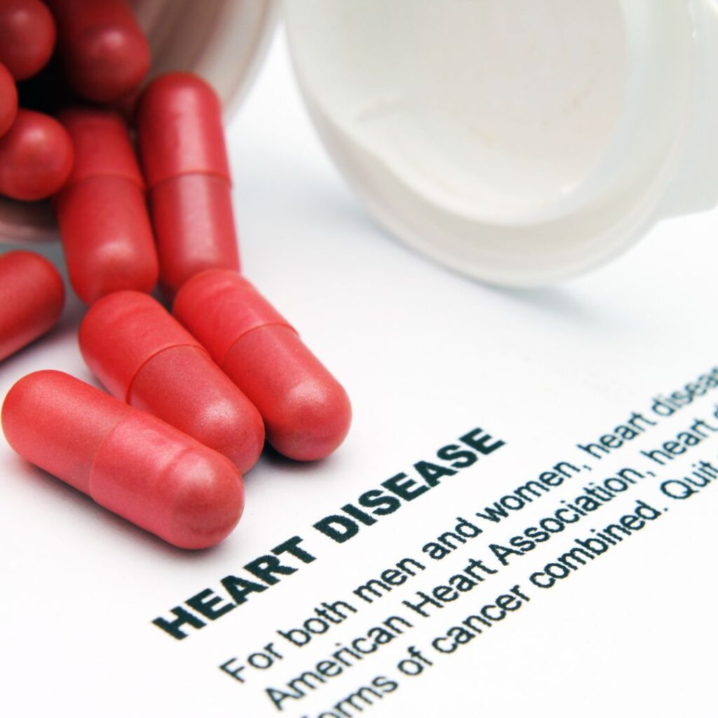 blog post by cardiologist dr. kathryn mcfarland about heart health and heart disease image of red pills and text that says heart disease