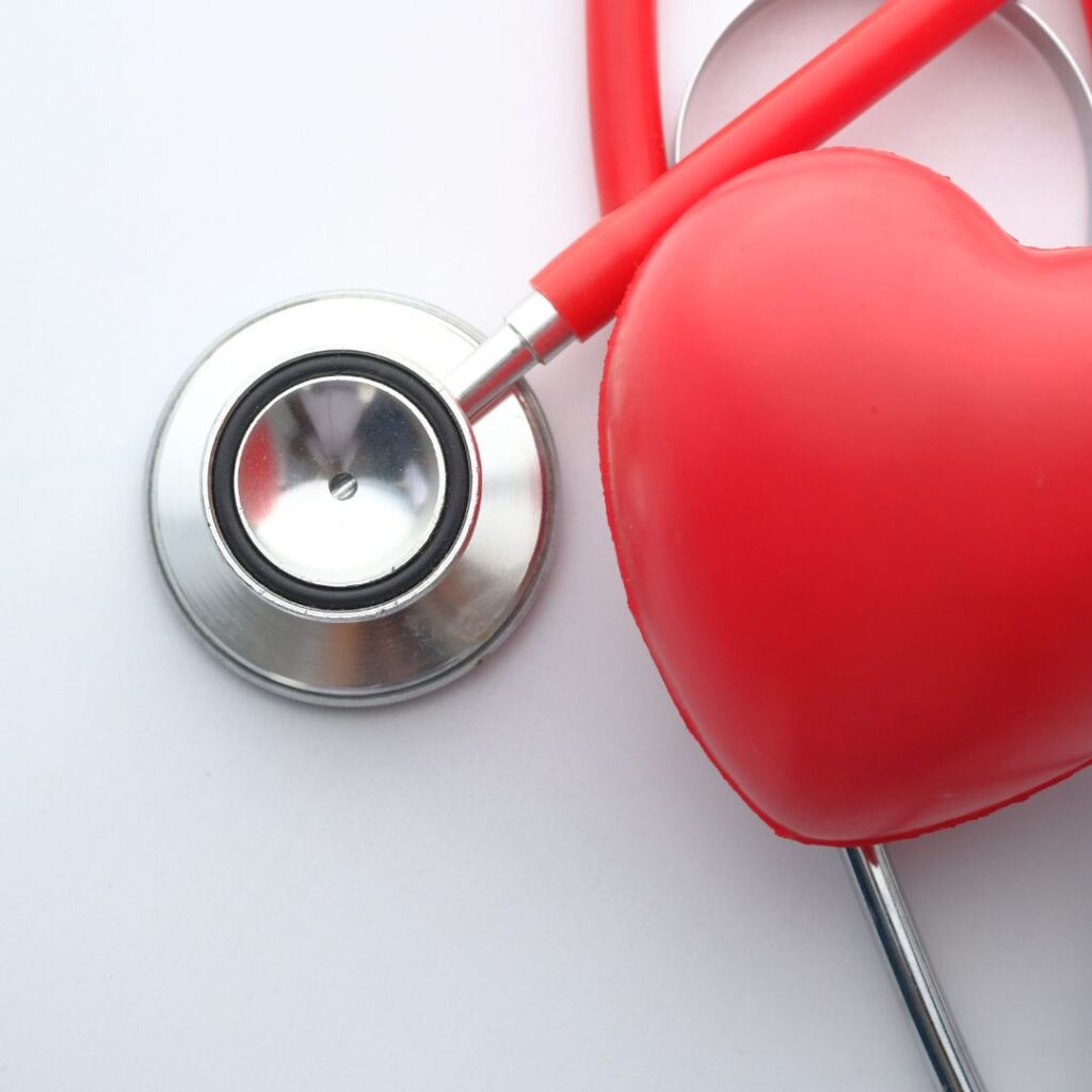 blog post by cardiologist dr. kathryn mcfarland about heart health and heart disease image of stethoscope and red heart